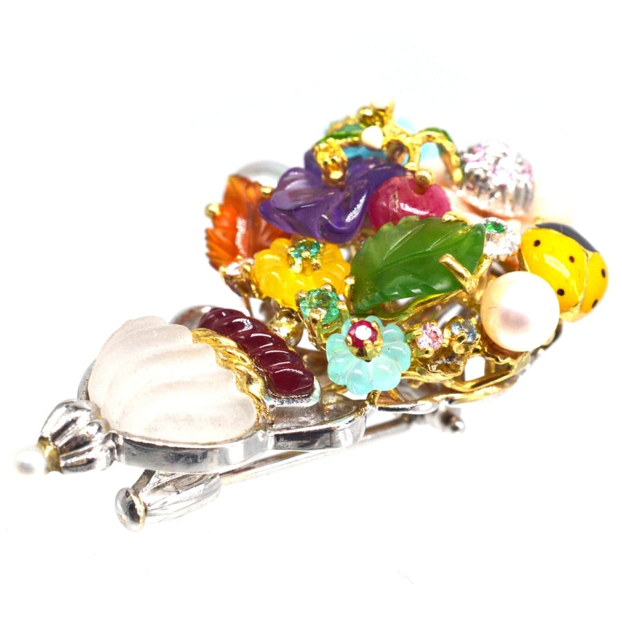 Vintage 18ct white gold brooch featuring multi-gem flowers, rock crystal vase and a yellow ladybird by Santagostino.