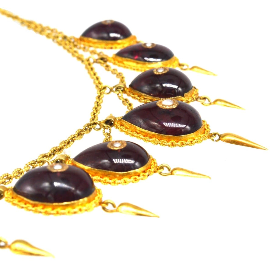 19th Century gold, cabochon garnet and seed pearl swag chain necklace featuring teardrop accents.