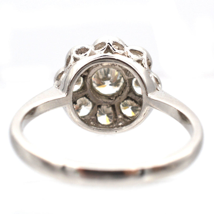 Art Deco platinum diamond cluster ring with sparkling diamonds in fine millegrain setting.