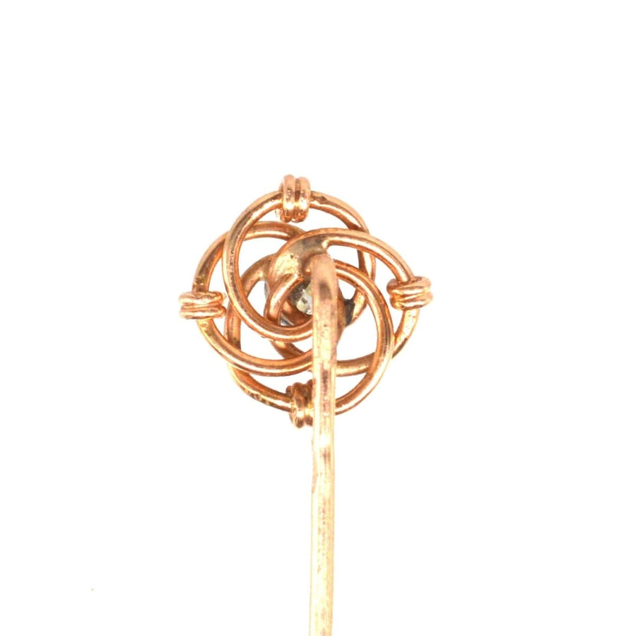 Early 20th century Austro-Hungarian gold and diamond knot tie pin, showcasing intricate design and vintage elegance.