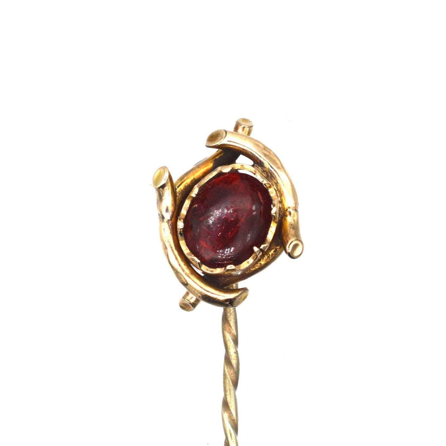 Edwardian 9ct gold tie pin featuring a stunning red cabochon paste resembling a garnet, ideal for colorful silk ties.