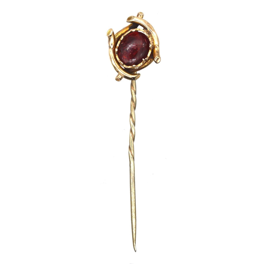Edwardian 9ct gold tie pin featuring a striking red cabochon paste, perfect for silk ties.
