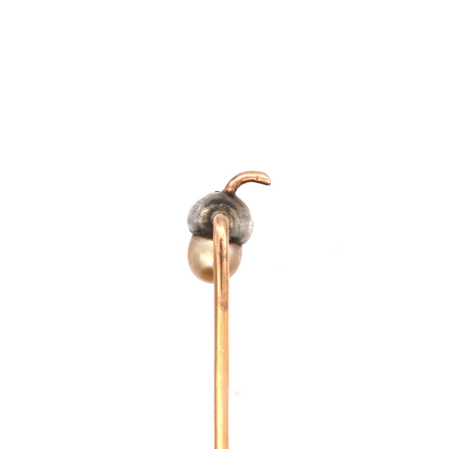 Elegant Edwardian 9ct gold and silver acorn tie pin featuring diamond and natural pearl detailing.