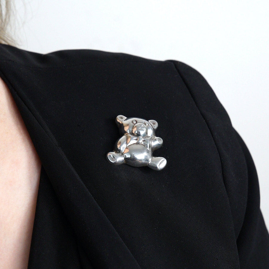 Mid Century silver teddy bear brooch pendant with bow tie, ideal for christening or new baby gift.