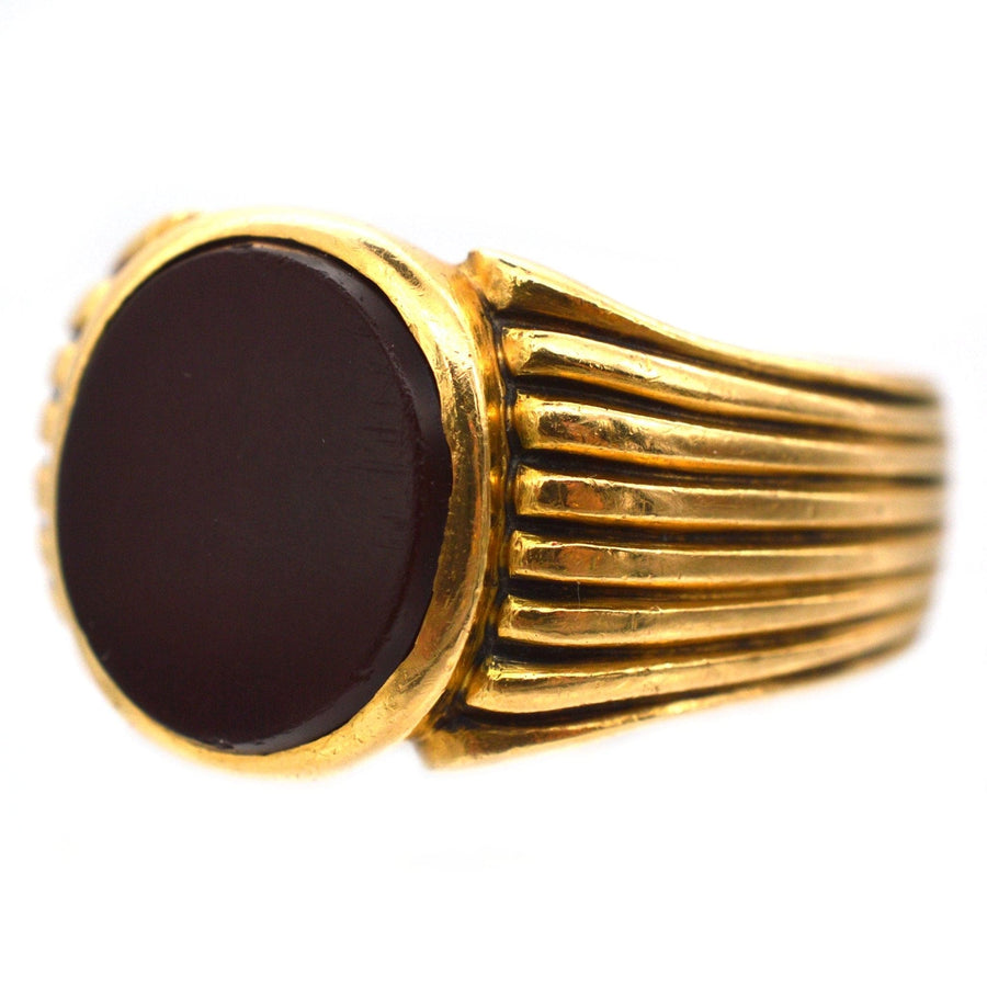 Victorian 18ct gold signet ring featuring a round carnelian stone, made in London, 1888.