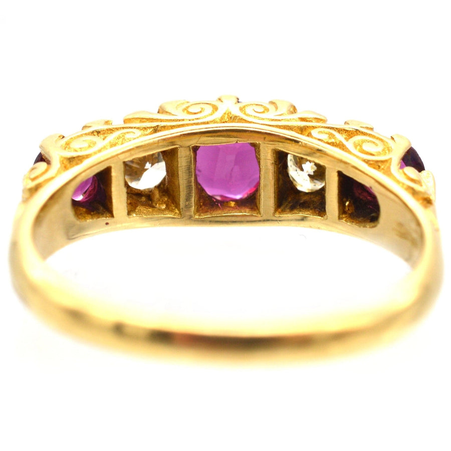 Victorian-style 1970s 18ct gold hoop ring featuring rubies and diamonds, showcasing intricate design and craftsmanship.