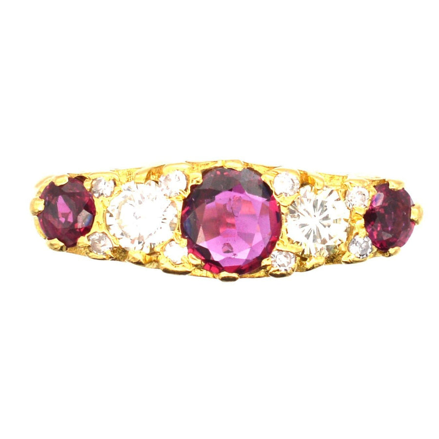 Victorian-style 1970s 18ct gold ring featuring ruby doublets and diamonds in a half carved hoop design.